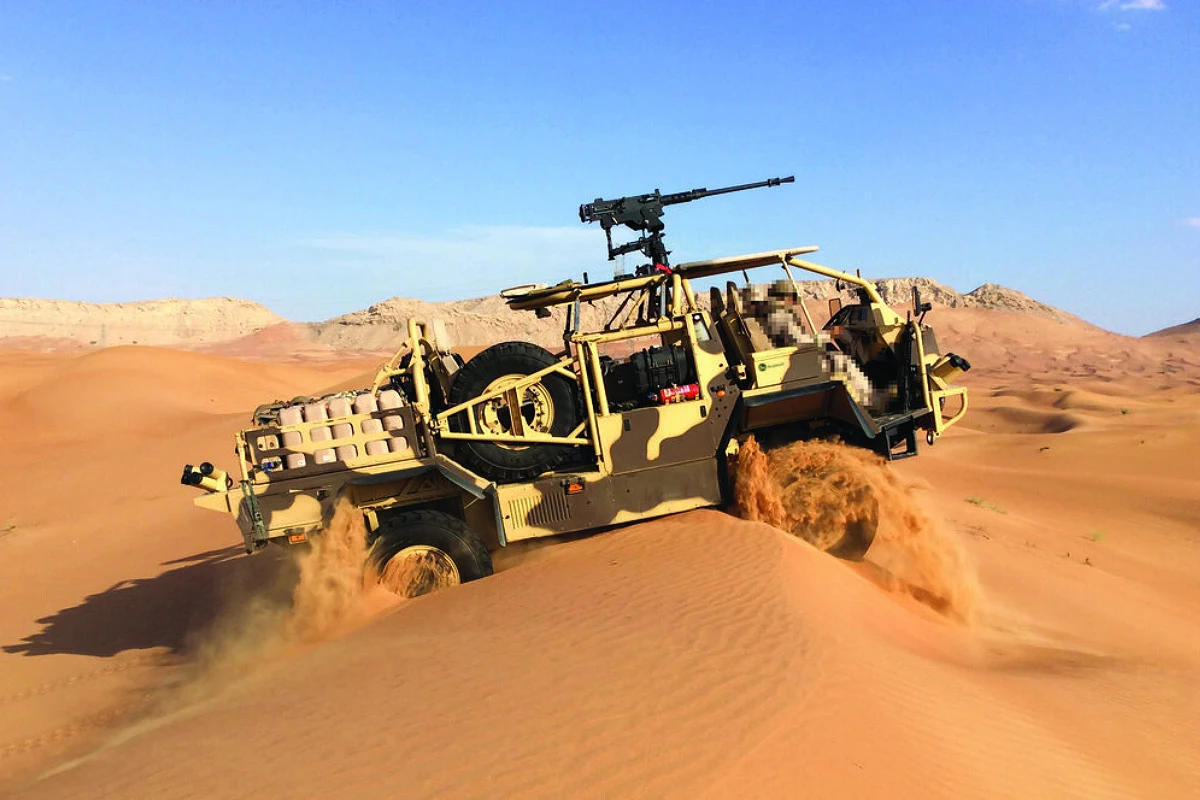Supacat vehicle traversing sand dunes